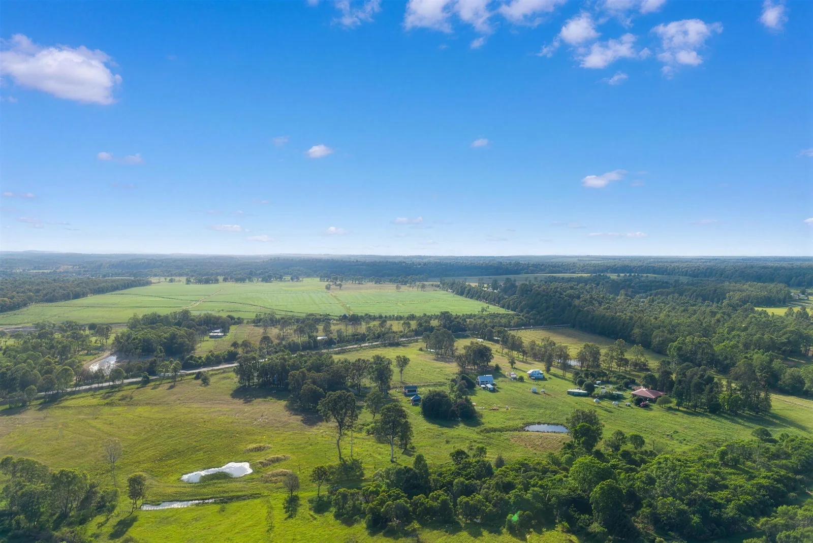 Aerial view over open paddocks and farmland at Tinana, Fraser Coast